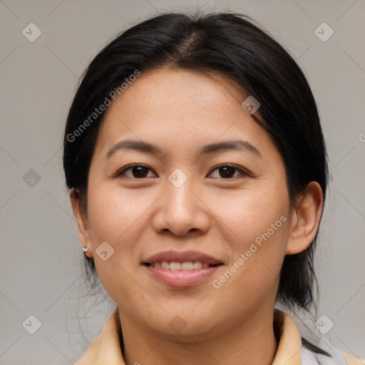 Joyful asian young-adult female with medium  brown hair and brown eyes