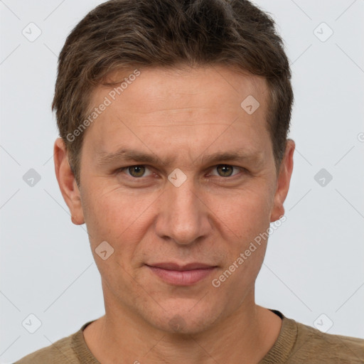 Joyful white adult male with short  brown hair and grey eyes