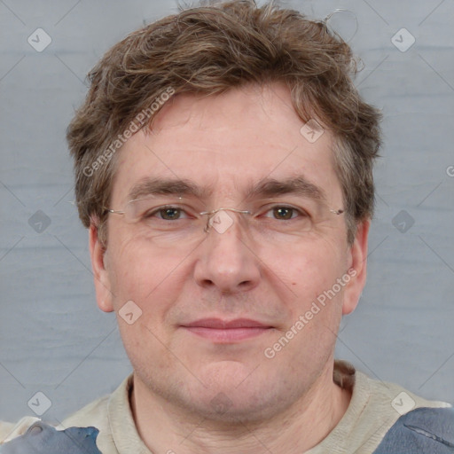 Joyful white adult male with short  brown hair and blue eyes