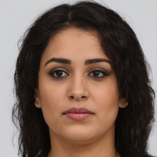 Neutral latino young-adult female with long  brown hair and brown eyes