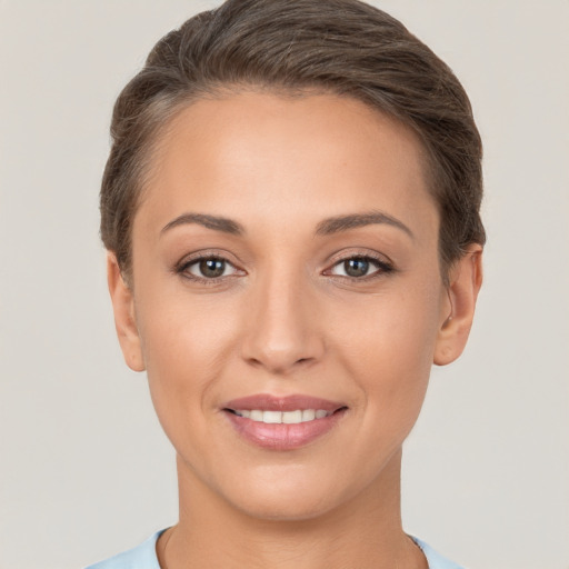 Joyful white young-adult female with short  brown hair and brown eyes