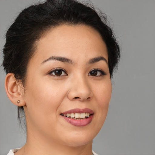 Joyful asian young-adult female with medium  brown hair and brown eyes
