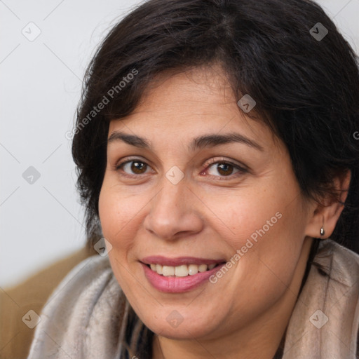 Joyful white adult female with long  brown hair and brown eyes