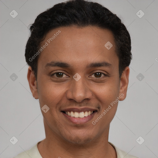 Joyful latino young-adult male with short  black hair and brown eyes