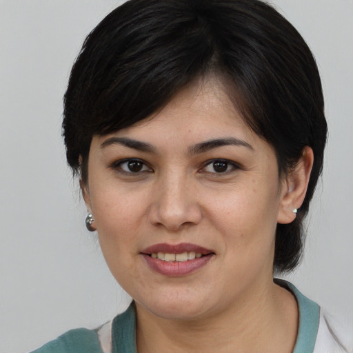 Joyful white young-adult female with medium  brown hair and brown eyes
