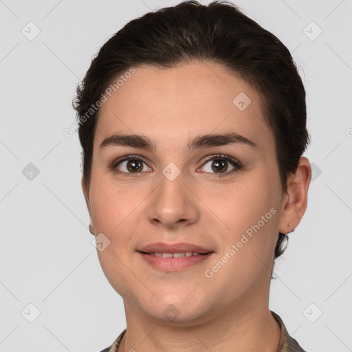 Joyful white young-adult female with short  brown hair and brown eyes