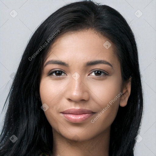 Joyful latino young-adult female with long  black hair and brown eyes