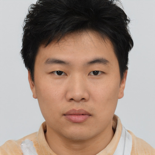 Neutral asian young-adult male with short  brown hair and brown eyes