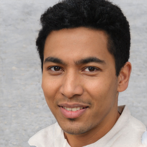Joyful asian young-adult male with short  black hair and brown eyes