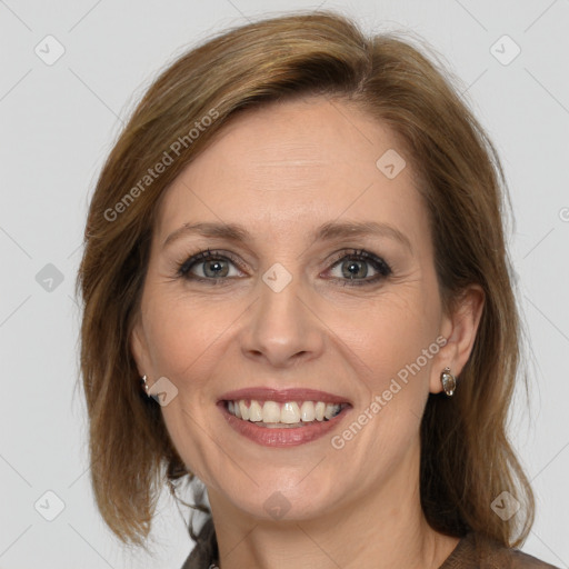 Joyful white adult female with medium  brown hair and brown eyes