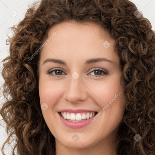 Joyful white young-adult female with long  brown hair and green eyes