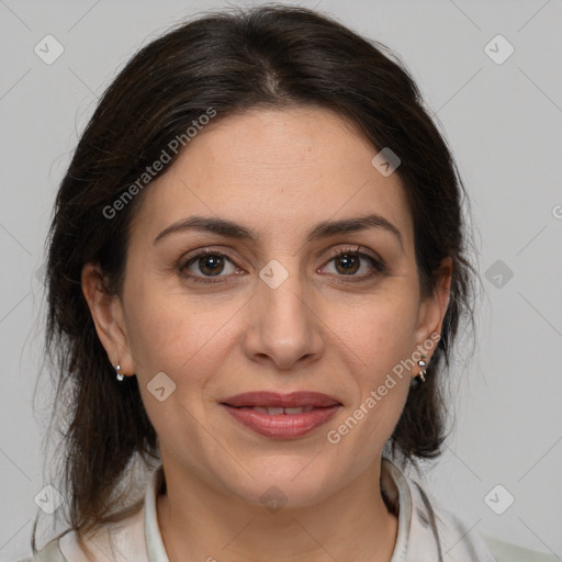 Joyful white adult female with medium  brown hair and brown eyes