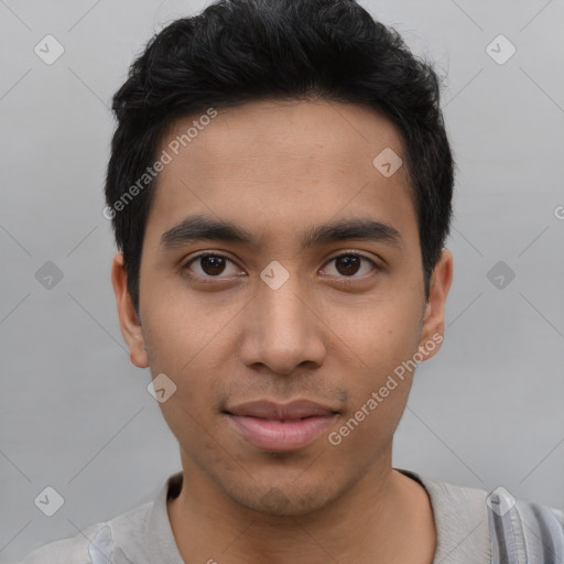 Joyful asian young-adult male with short  black hair and brown eyes