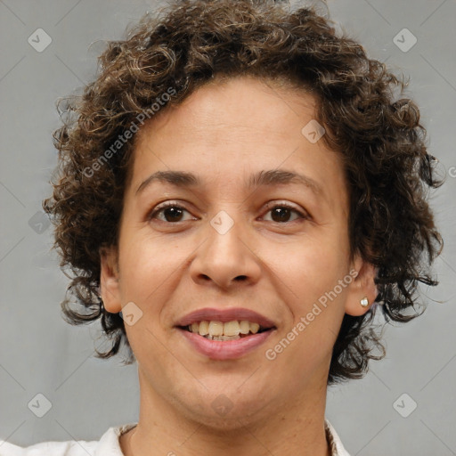 Joyful white adult female with short  brown hair and brown eyes