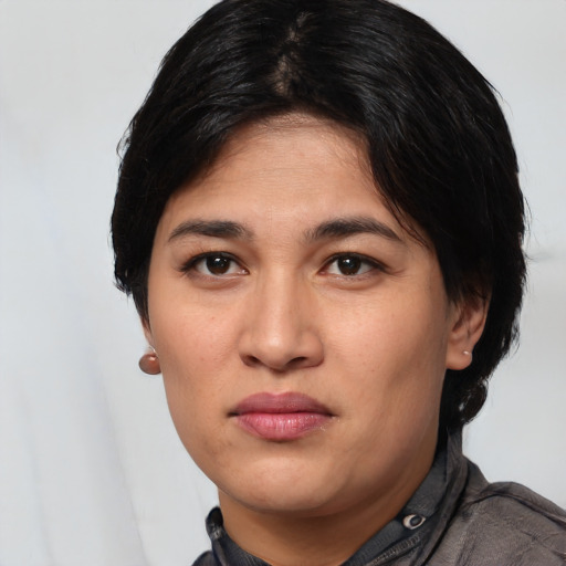Joyful white young-adult female with short  black hair and brown eyes