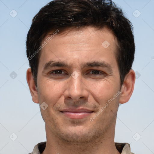 Joyful white adult male with short  brown hair and brown eyes