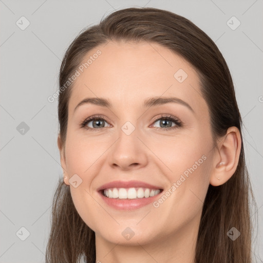 Joyful white young-adult female with long  brown hair and grey eyes