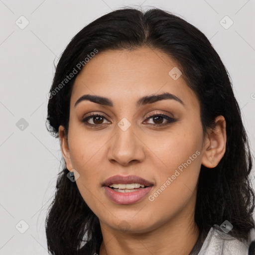 Joyful latino young-adult female with long  black hair and brown eyes