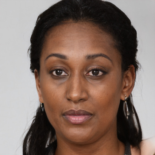 Neutral black adult female with long  brown hair and brown eyes
