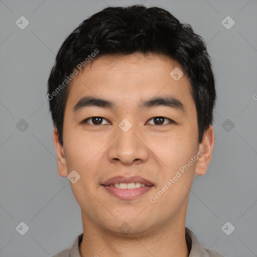 Joyful asian young-adult male with short  black hair and brown eyes