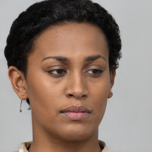Neutral latino young-adult female with short  brown hair and brown eyes