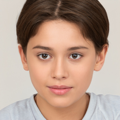 Joyful white child female with short  brown hair and brown eyes