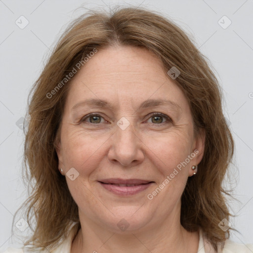 Joyful white adult female with medium  brown hair and grey eyes