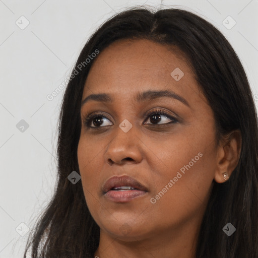 Joyful asian young-adult female with long  brown hair and brown eyes