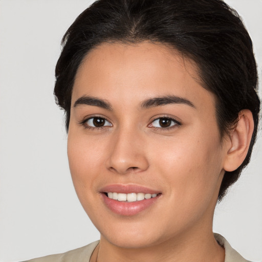 Joyful white young-adult female with medium  brown hair and brown eyes