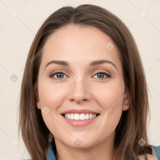 Joyful white young-adult female with long  brown hair and grey eyes