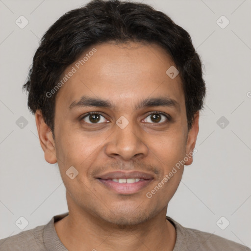 Joyful latino young-adult male with short  brown hair and brown eyes