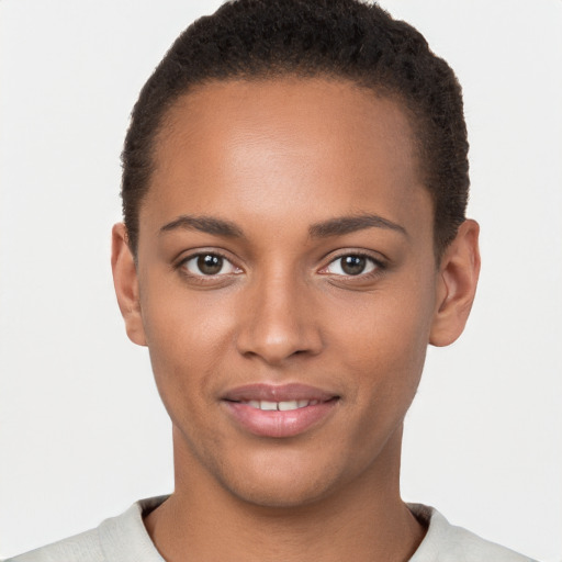 Joyful black young-adult female with short  brown hair and brown eyes