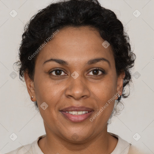 Joyful black adult female with short  brown hair and brown eyes