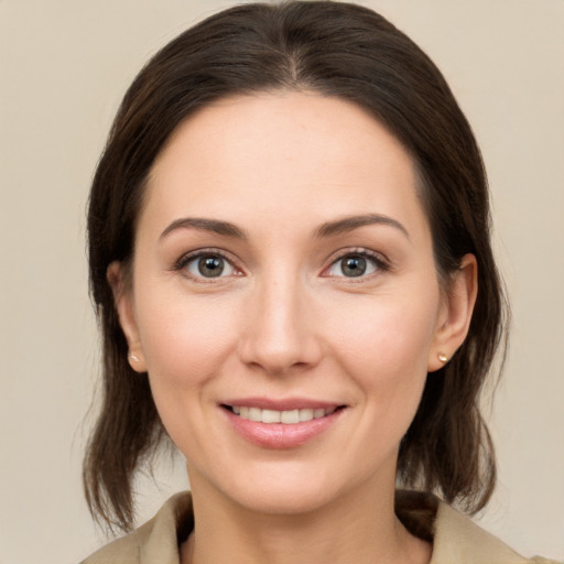 Joyful white young-adult female with medium  brown hair and brown eyes