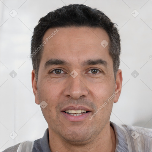 Joyful white adult male with short  black hair and brown eyes