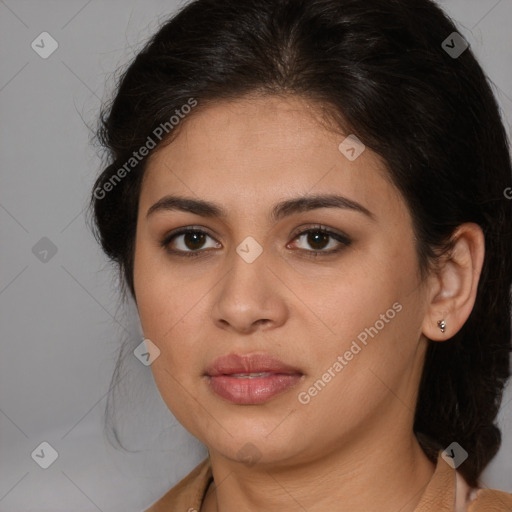 Joyful latino young-adult female with long  brown hair and brown eyes