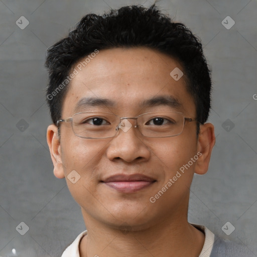 Joyful asian young-adult male with short  black hair and brown eyes