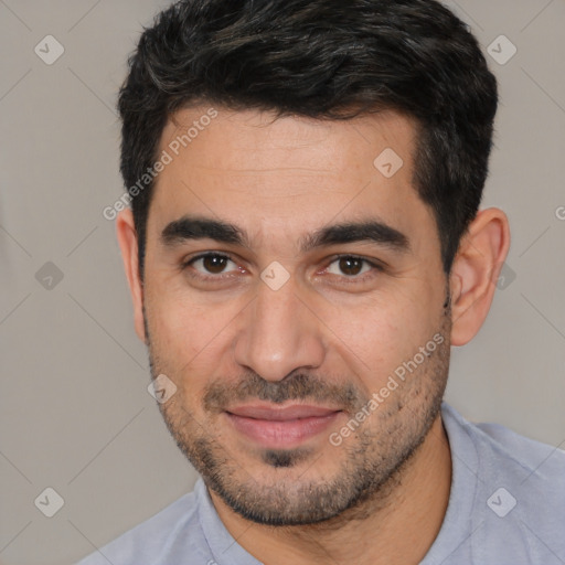 Joyful white young-adult male with short  black hair and brown eyes