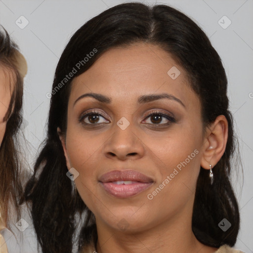 Joyful latino young-adult female with medium  brown hair and brown eyes