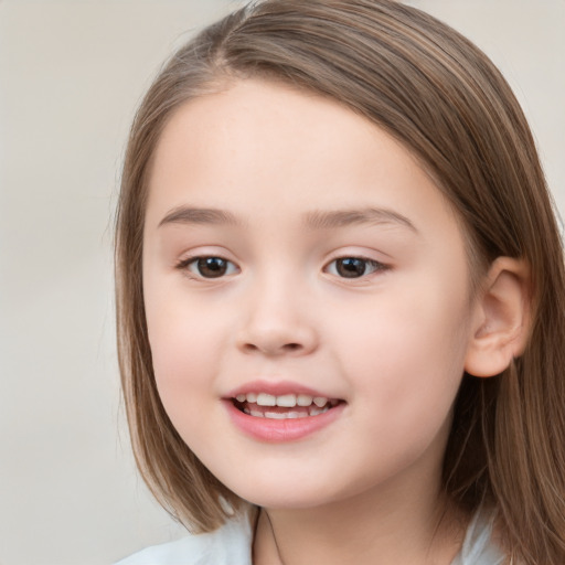 Joyful white child female with medium  brown hair and brown eyes