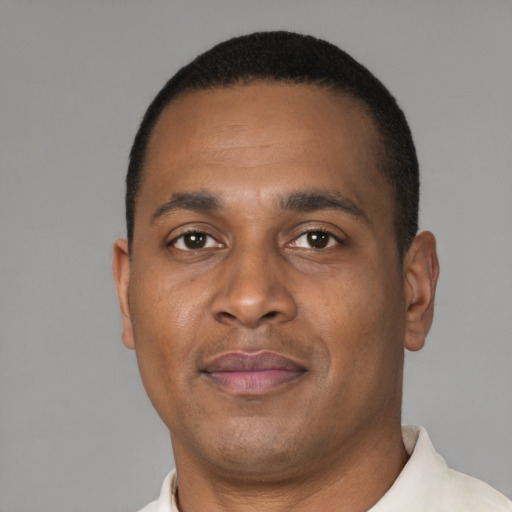 Neutral black adult male with short  brown hair and brown eyes