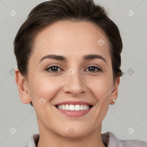 Joyful white young-adult female with short  brown hair and grey eyes