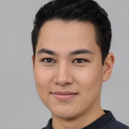 Joyful asian young-adult male with short  brown hair and brown eyes