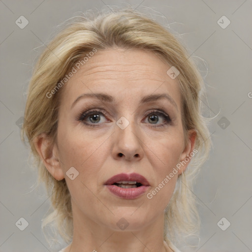 Joyful white adult female with medium  brown hair and blue eyes