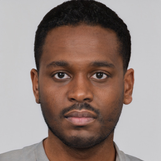 Neutral black young-adult male with short  brown hair and brown eyes