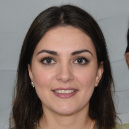 Joyful white young-adult female with medium  brown hair and brown eyes