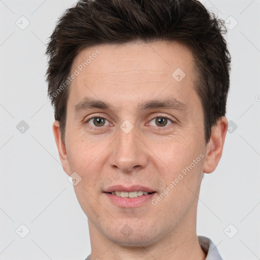 Joyful white adult male with short  brown hair and brown eyes