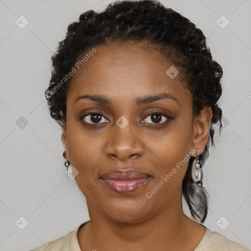 Joyful black young-adult female with long  black hair and brown eyes