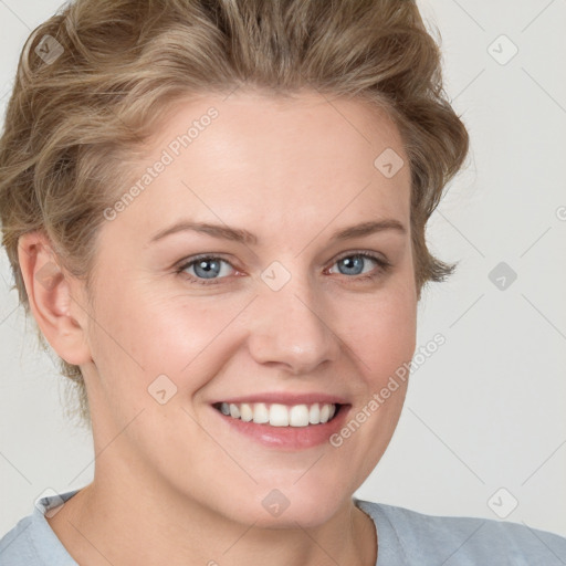 Joyful white young-adult female with medium  brown hair and blue eyes