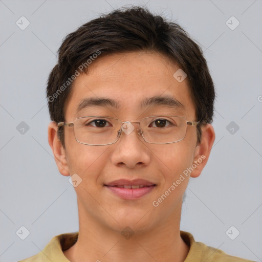 Joyful asian young-adult male with short  brown hair and brown eyes